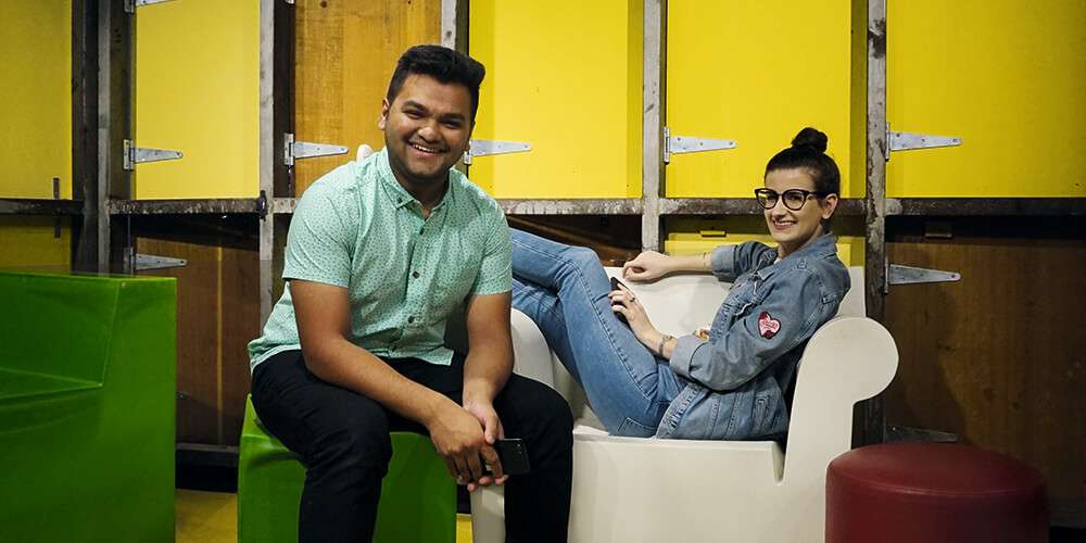 Satwik and Caitlin sit on chairs in Macquarie Uni's study hub to discuss data science jobs and their degree