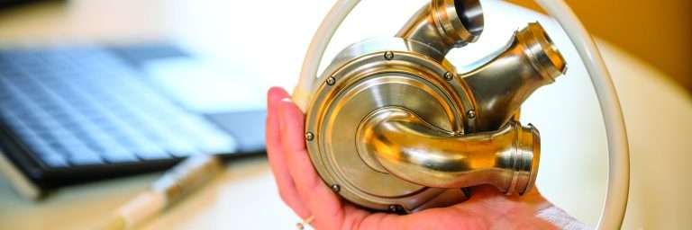 Hand holding artificial heart