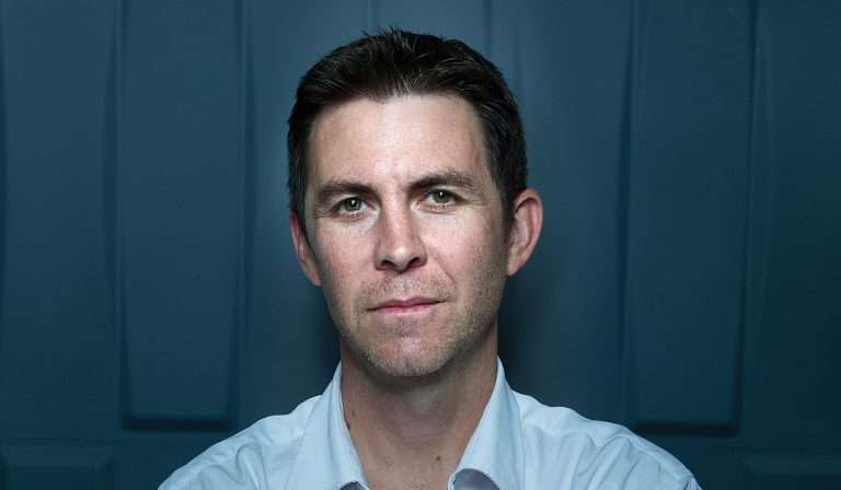 Man wearing pale blue shirt