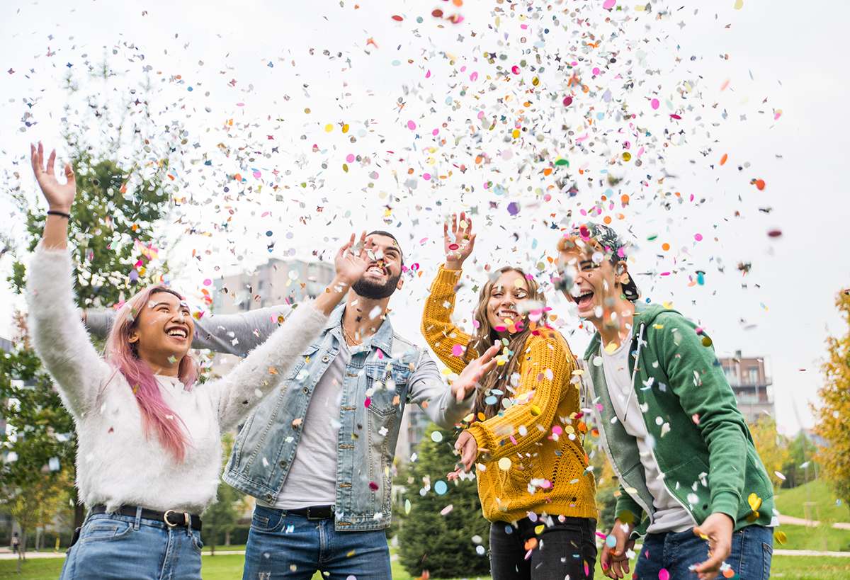 Happy young people meeting outdoors