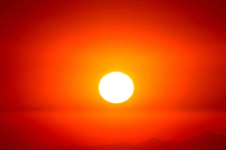 Warm sun in red sky