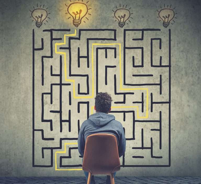 Confused business man brainstorming the labyrinth has a solution