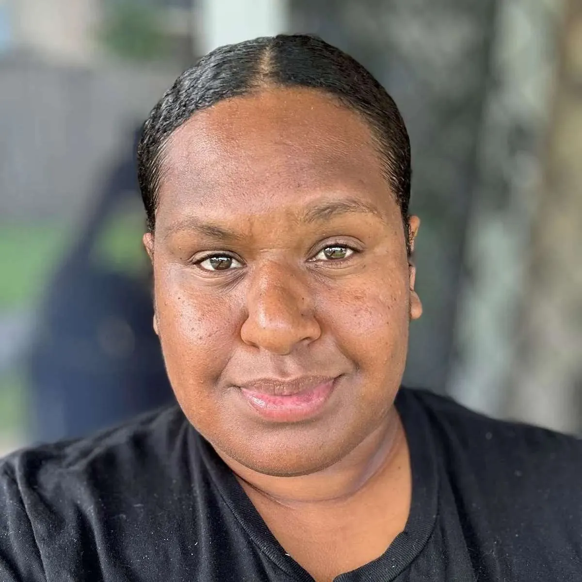 Aboriginal woman in a black t-shirt