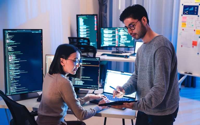 Programming and Collaboration for Software development on a Monitor screen showing Teamwork and Brainstorming for Technical computing to build a Future Strategy