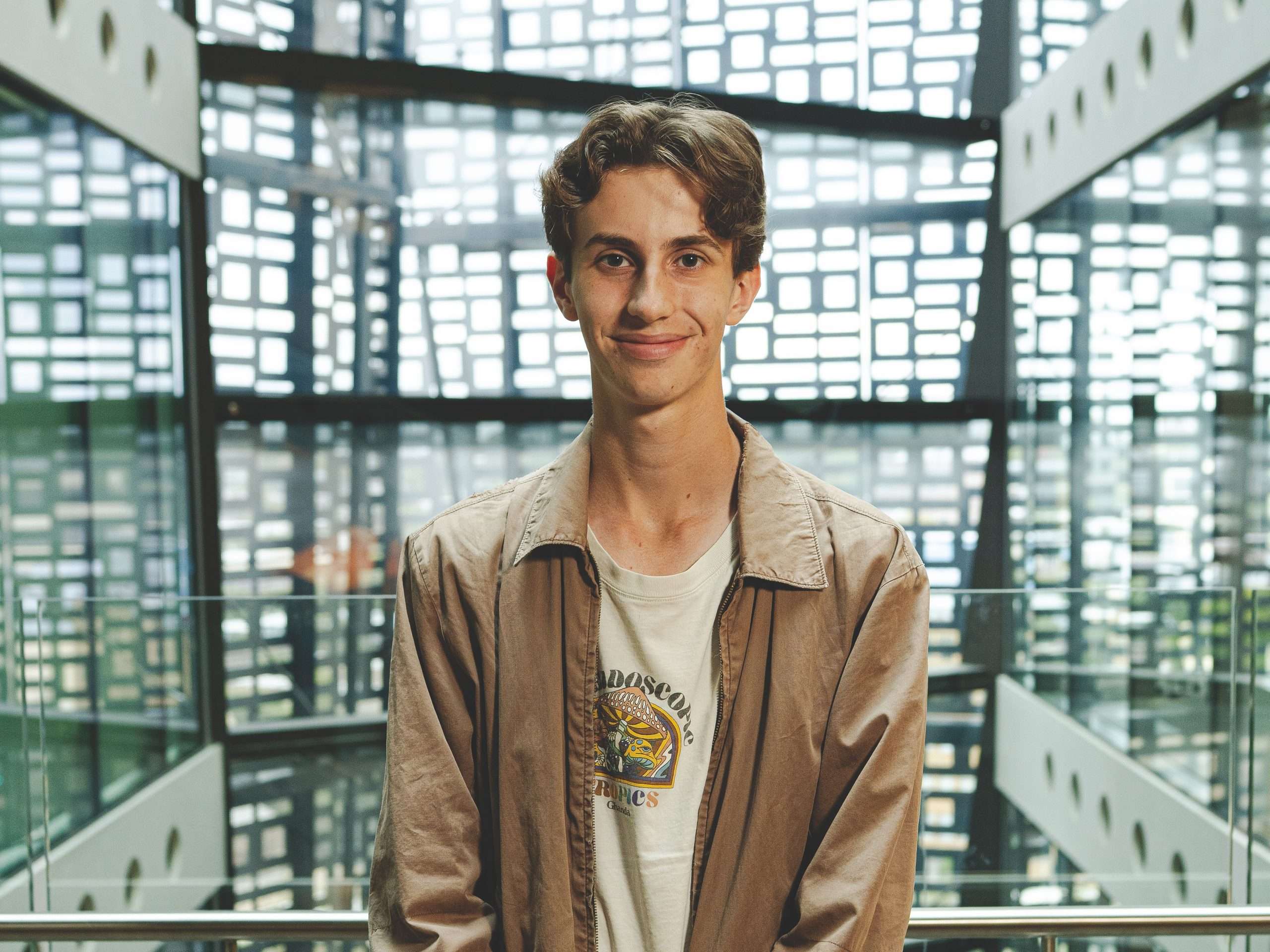 Man in brown shirt in futuristic setting
