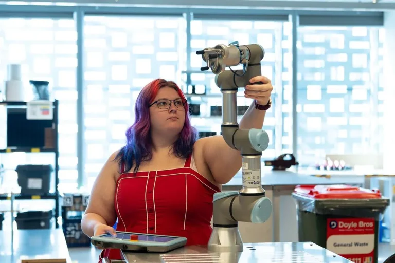 Woman with coloured hair and robotic device